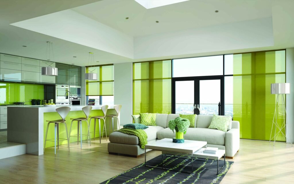Green panel blinds drawn across a wall of windows in a kitchen and living space