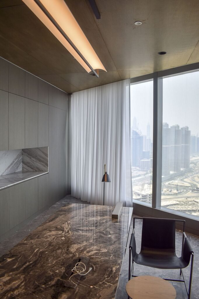 Tall translucent roller blind softening the view from a high-rise window