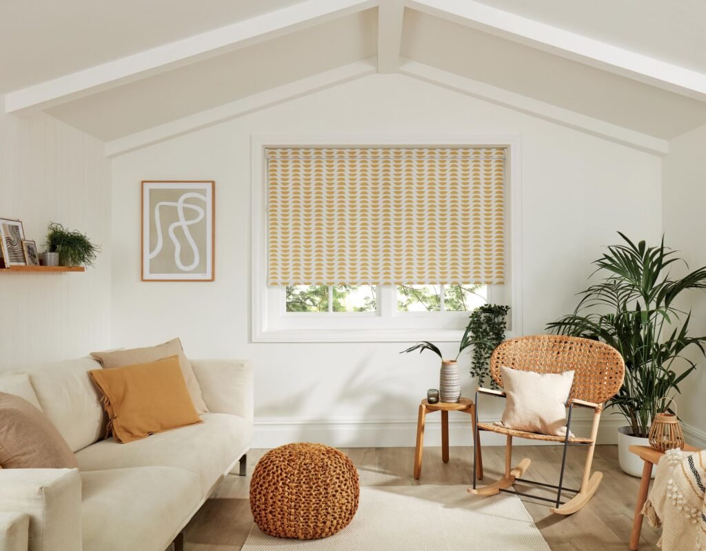 Ochre striped roller blind in a bright living room with rattan furniture