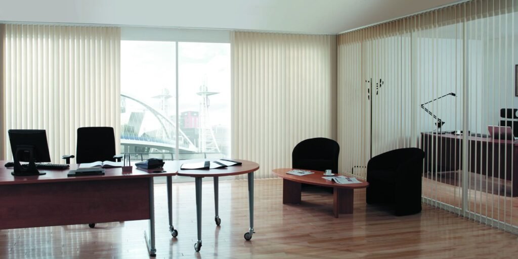 Pale vertical blinds across the windows of a private office