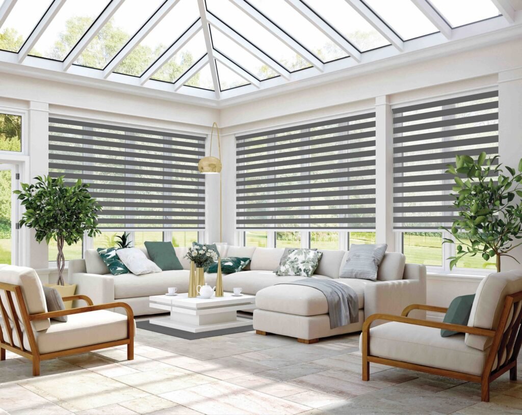 Charcoal vision blinds fitted around a bright garden room
